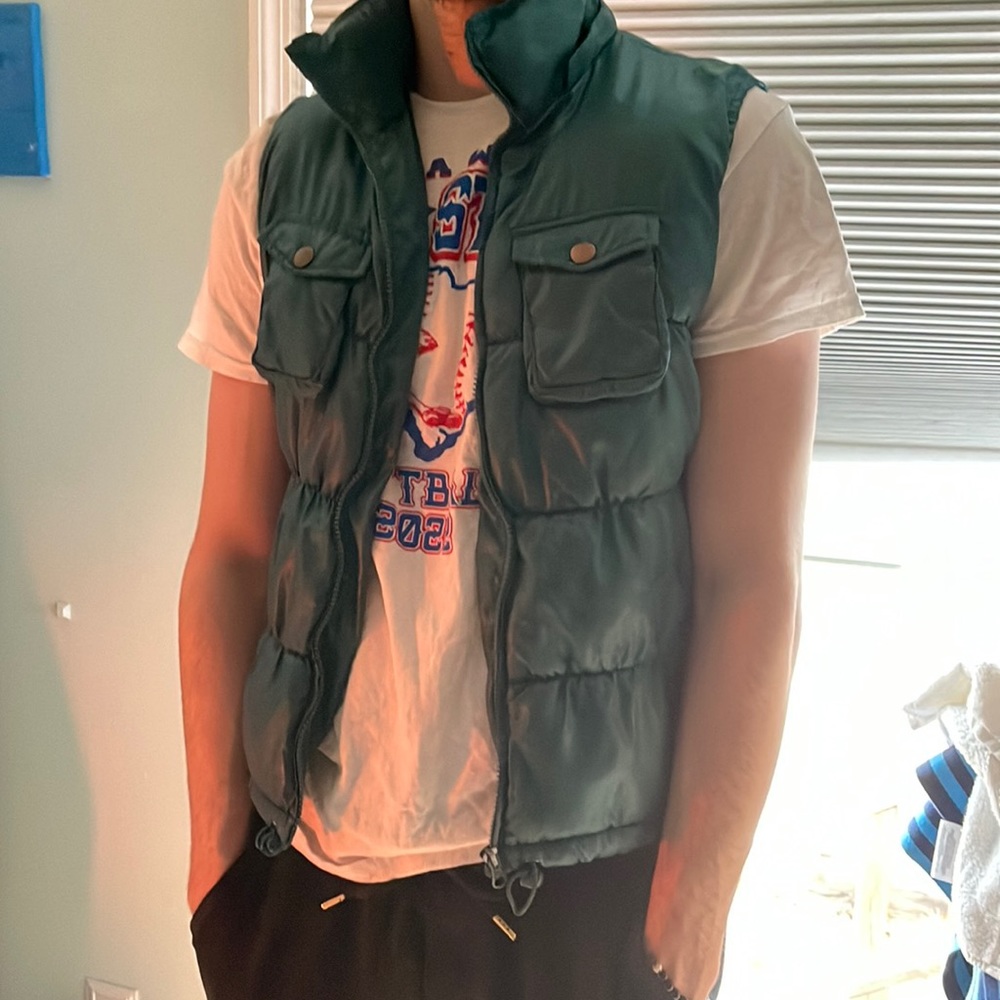 Green vest  (my boyfriend is wearing it in the picture)
